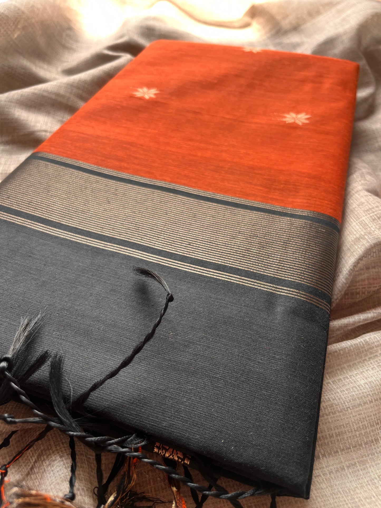 Orange Saree with Black Pallu & Golden Motifs