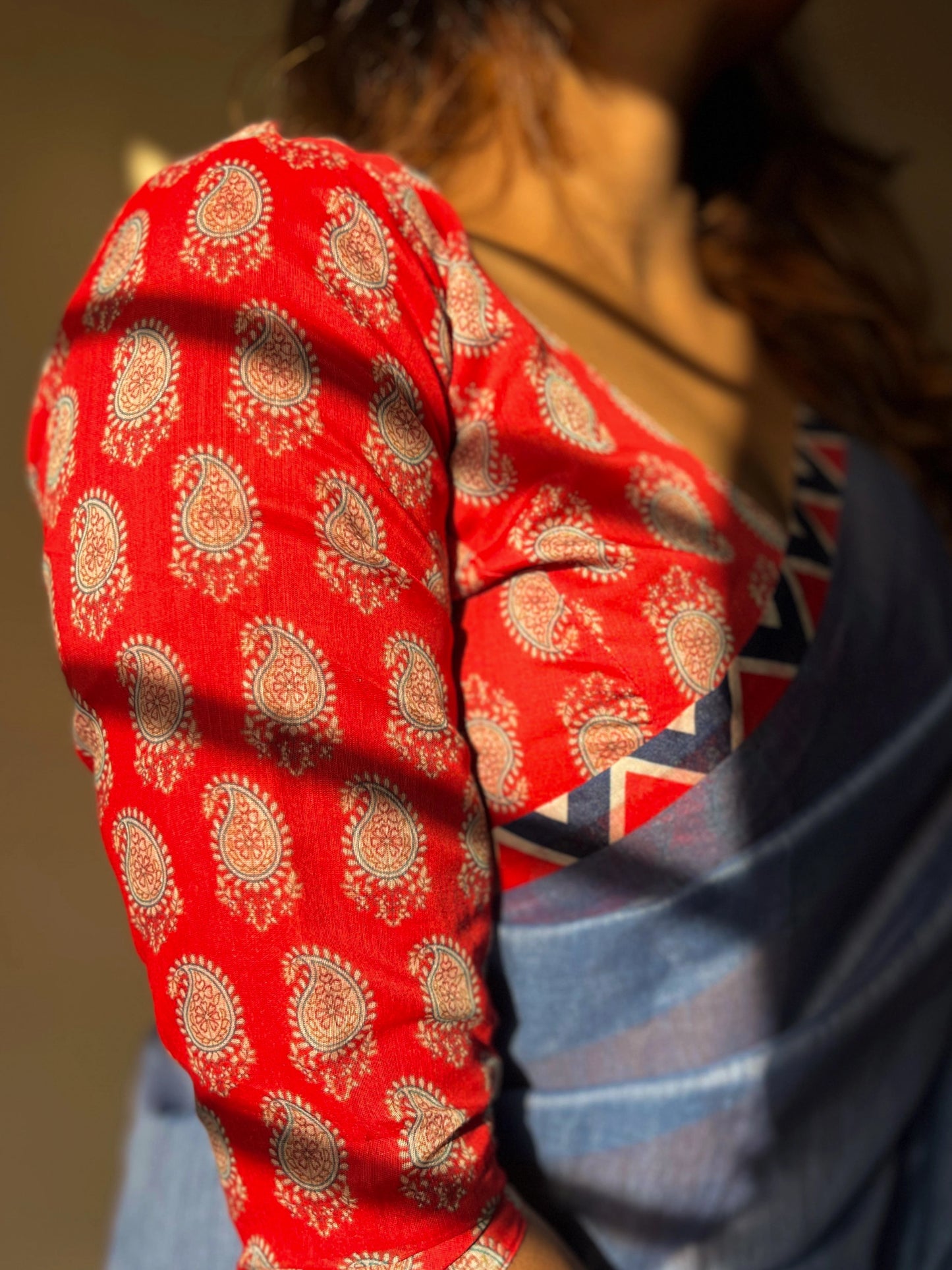 Blue Saree Paired With Red Printed Blouse