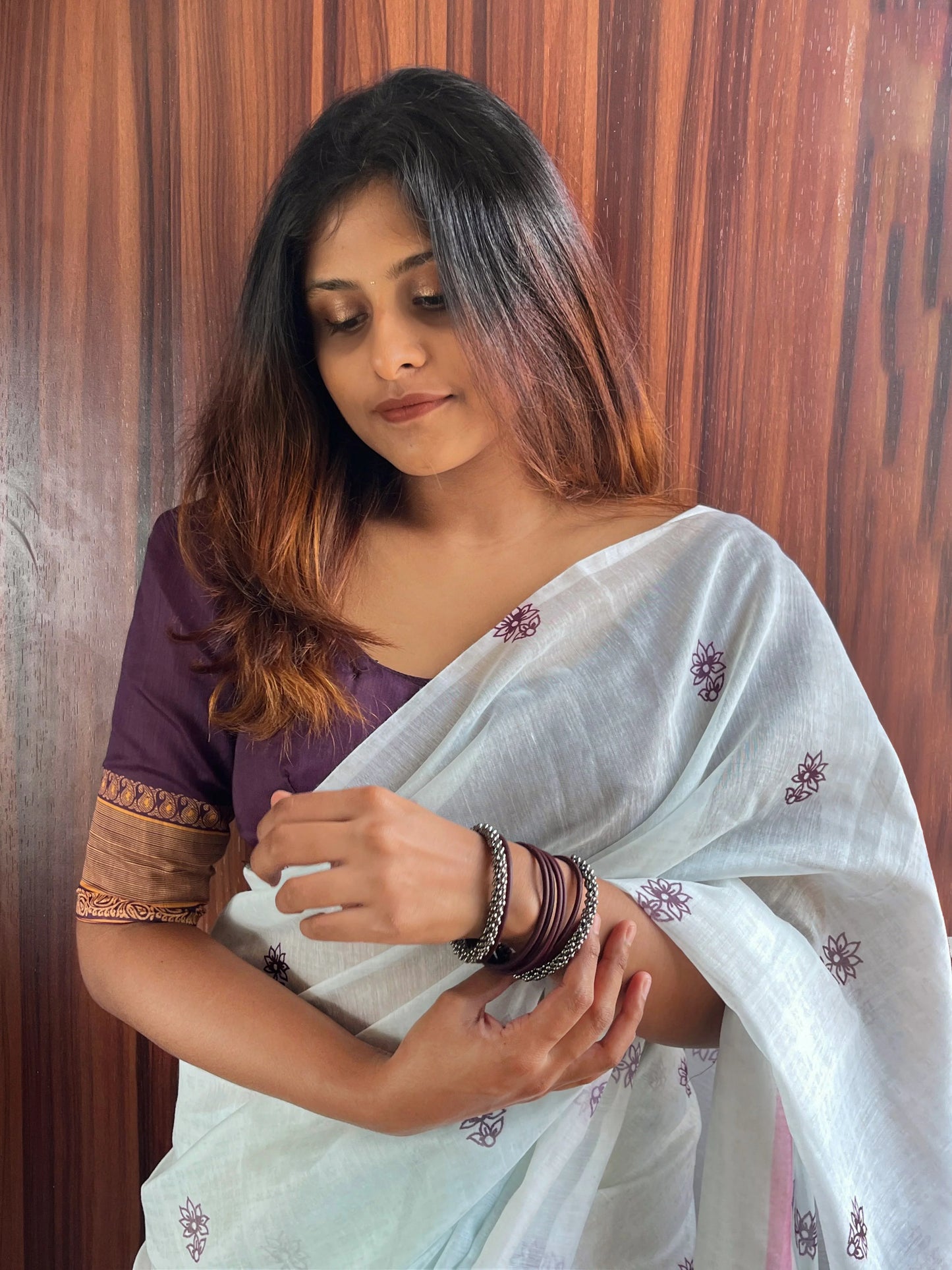 White Saree Paired With Plum Blouse