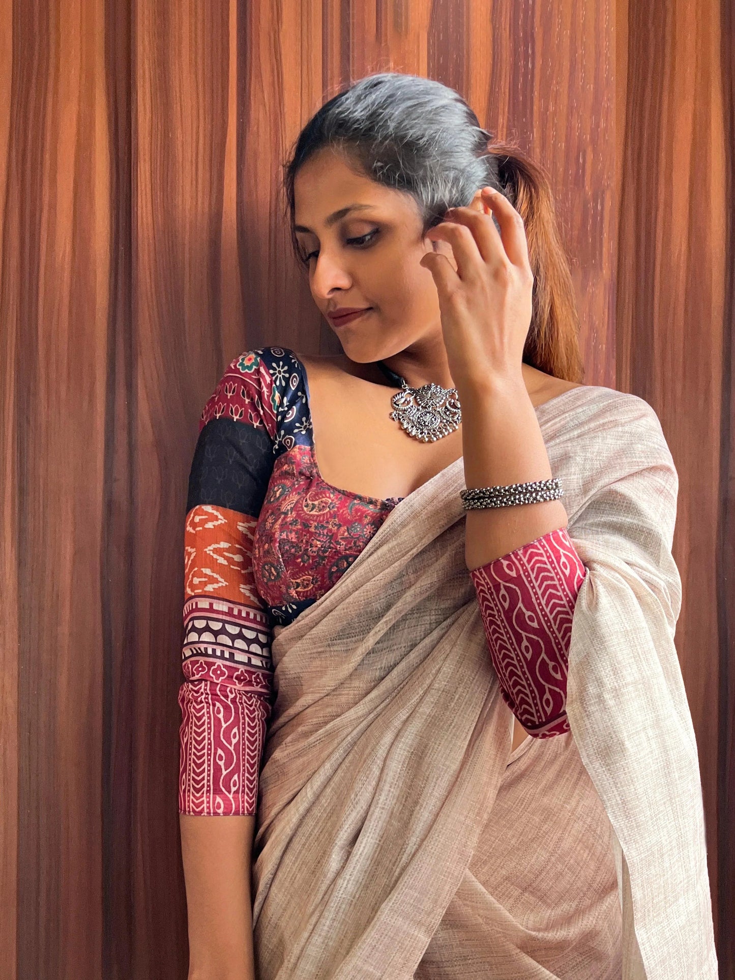 Cream Saree Paired With Printed Colorful Blouse