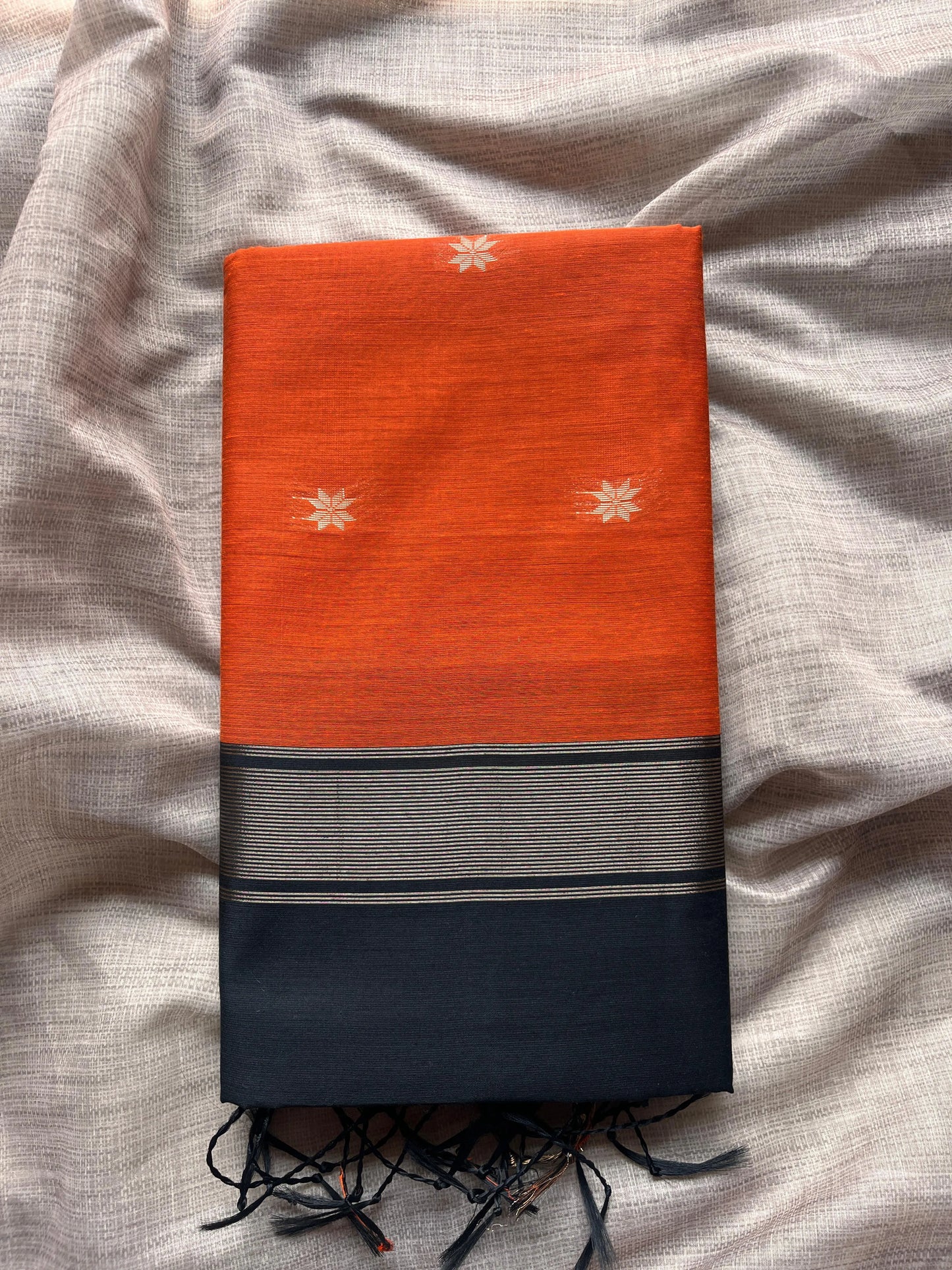Orange Saree with Black Pallu & Golden Motifs
