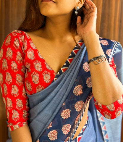 Blue Saree Paired With Red Printed Blouse